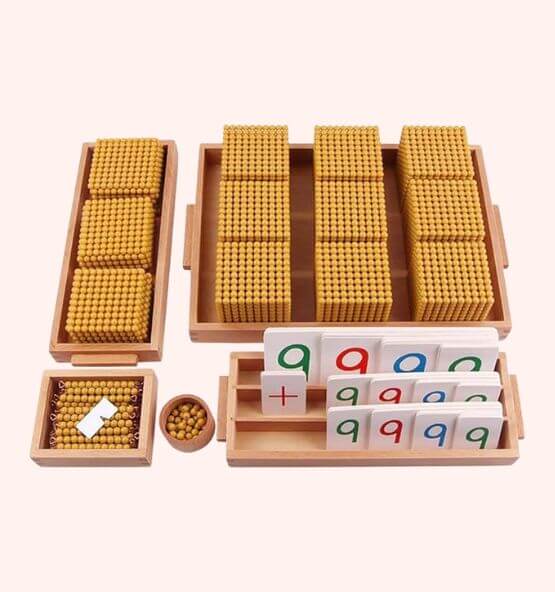 Montessori golden bead material set used for math learning, designed to teach children concepts of counting, addition, and place value.