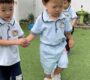 Children holding hands outdoor teamwork preschool activity Starshine Montessori 90x80