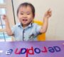 Happy child learning letters preschool activity Starshine Montessori 90x80