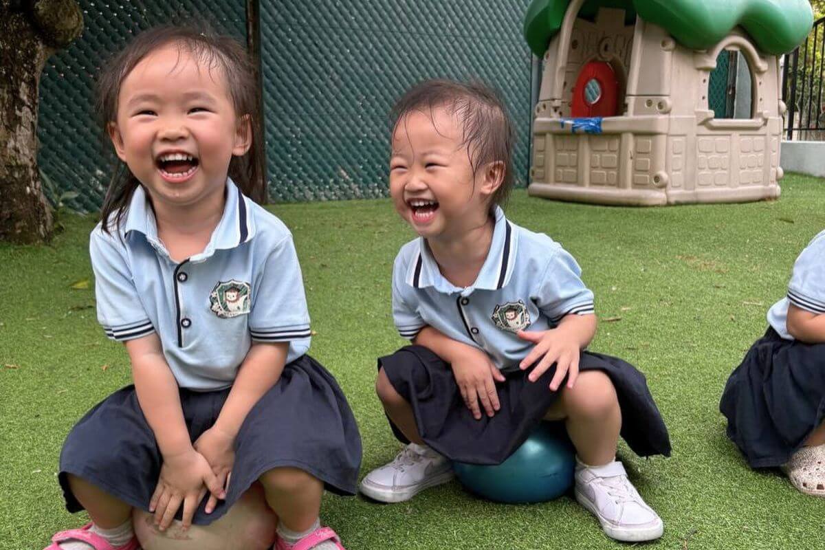 Happy children enjoying outdoor play during a fun preschool activity, promoting physical development and joyful learning at Starshine Montessori.