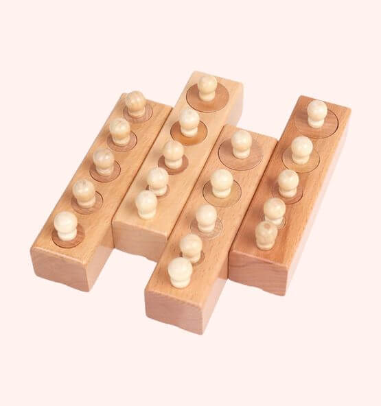 Montessori cylinder blocks educational toy, designed to enhance fine motor skills, concentration, and size differentiation in young children.