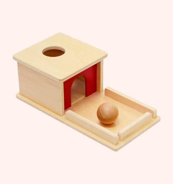 Montessori object permanence box designed for infant learning, helping babies develop hand-eye coordination and understand object permanence.