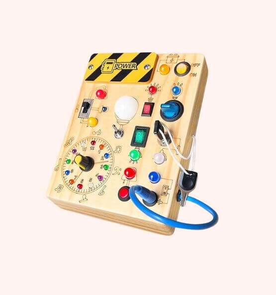 Montessori wooden busy board with electronic components – Interactive sensory activity board featuring switches, buttons, lights, and dials designed to enhance fine motor skills, problem-solving, and STEM learning through hands-on play.